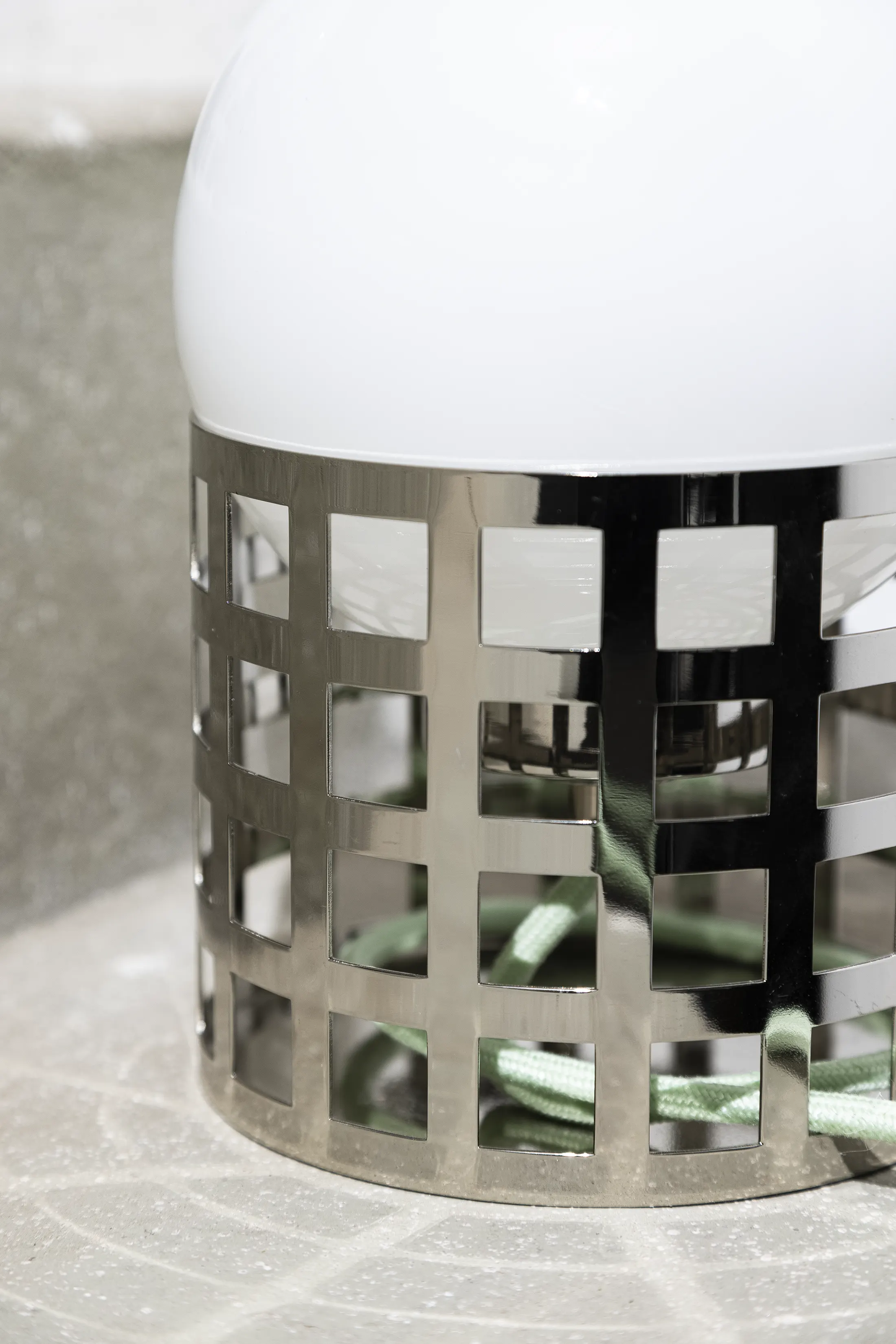 Full Moon Ride Table Lamp - Inspired by the iconic chrome finishes of the Mid Century era. Features a meticulously crafted grid pattern accentuating its geometric harmony. Conceptually alluring and transcending boundaries of conventional lighting.